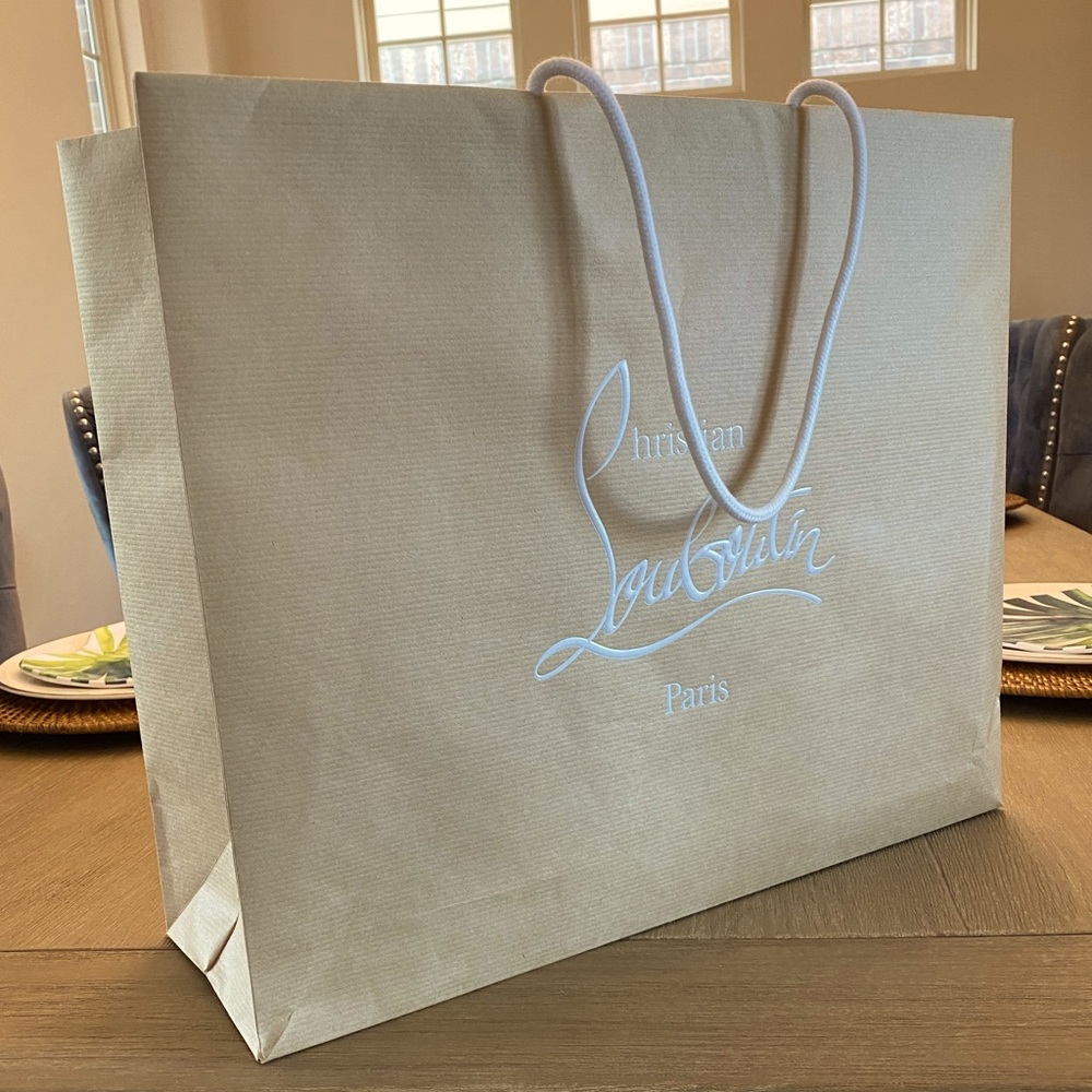 Authentic Christian Louboutin paper bag.
